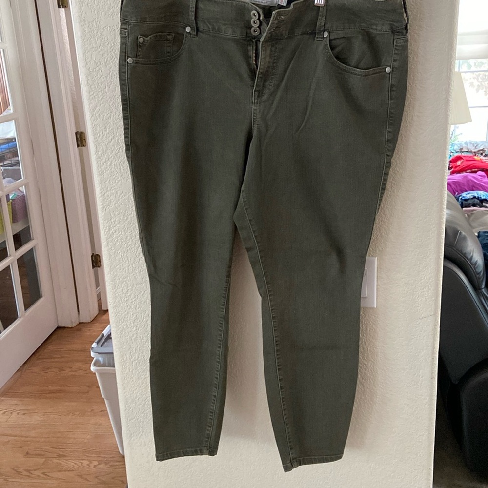 Plus size olive colored denim jeans from Torrid.